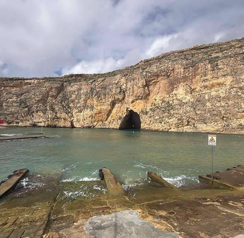 Inland Sea at Dwejra, Gozo, showing the boat ramps, sheltered water and entrance to the sea tunnel